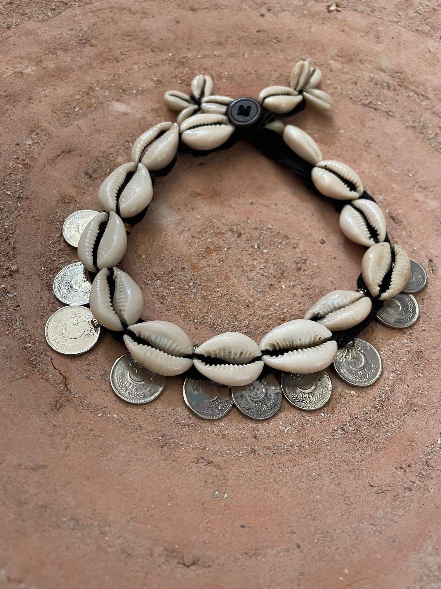 Cowrie shell necklace and vintage coins