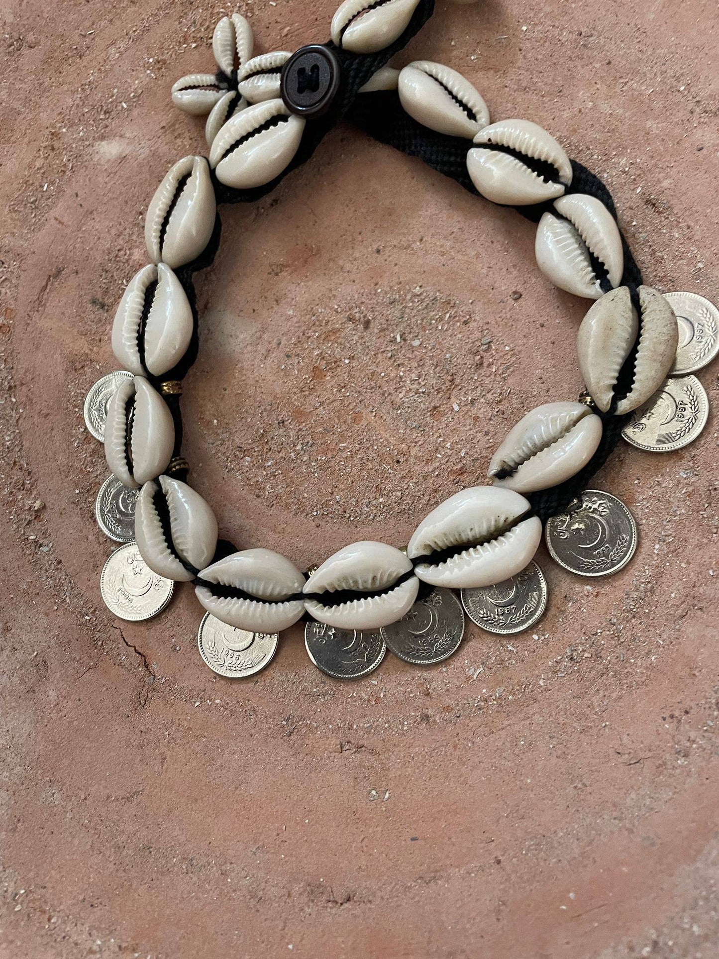 Cowrie shell necklace and vintage coins